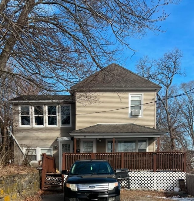 back of house featuring cooling unit