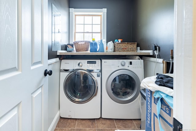 laundry area featuring separate washer and dryer and dark tile patterned flooring