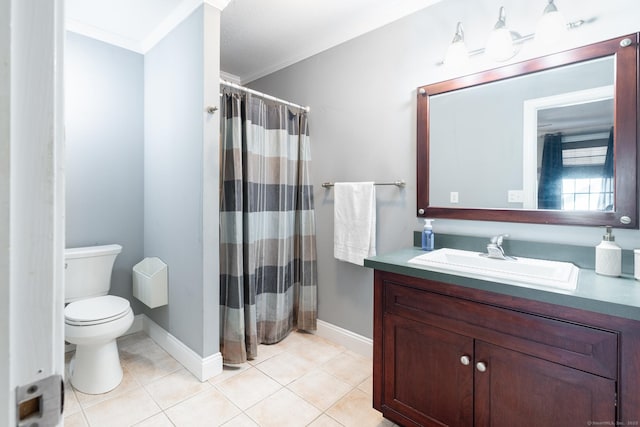 bathroom featuring tile patterned flooring, vanity, crown molding, and toilet