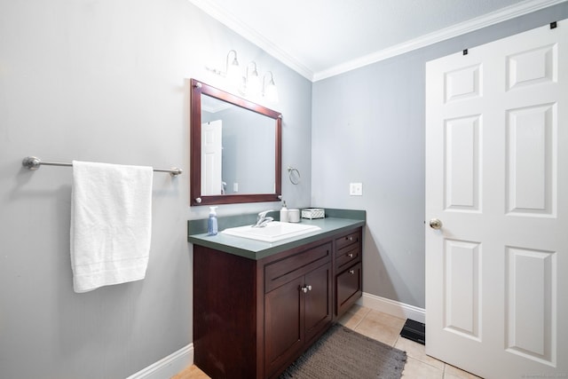 bathroom with crown molding, vanity, and tile patterned flooring