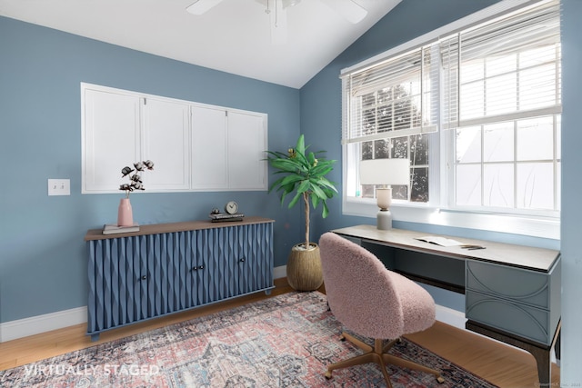 office featuring vaulted ceiling, ceiling fan, and light hardwood / wood-style flooring