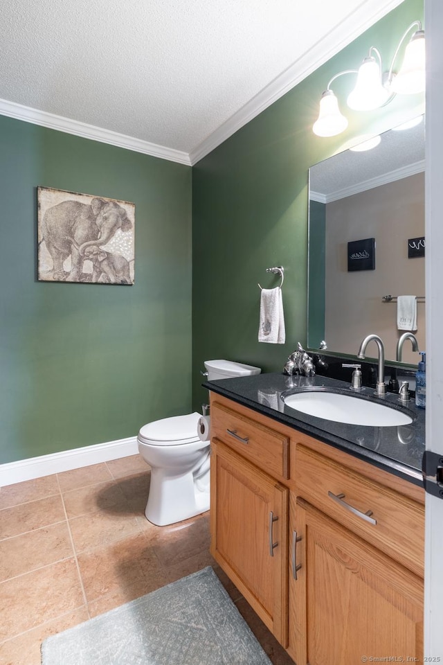 bathroom with tile patterned flooring, vanity, ornamental molding, and toilet