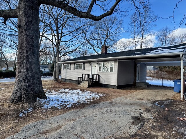 view of front of house featuring a carport