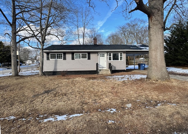 single story home featuring entry steps and a chimney