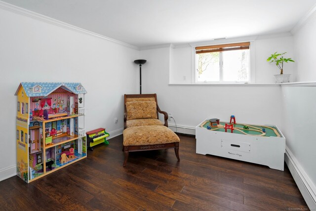 sitting room with ornamental molding, dark hardwood / wood-style floors, and baseboard heating