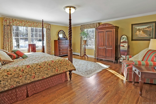 bedroom featuring multiple windows, ornamental molding, and wood-type flooring