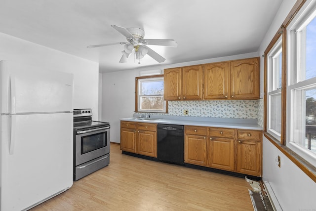 kitchen with sink, stainless steel electric range, dishwasher, white refrigerator, and light hardwood / wood-style floors