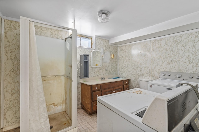 clothes washing area with sink and independent washer and dryer