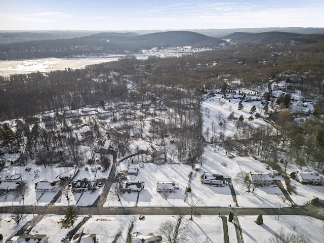 snowy aerial view with a mountain view