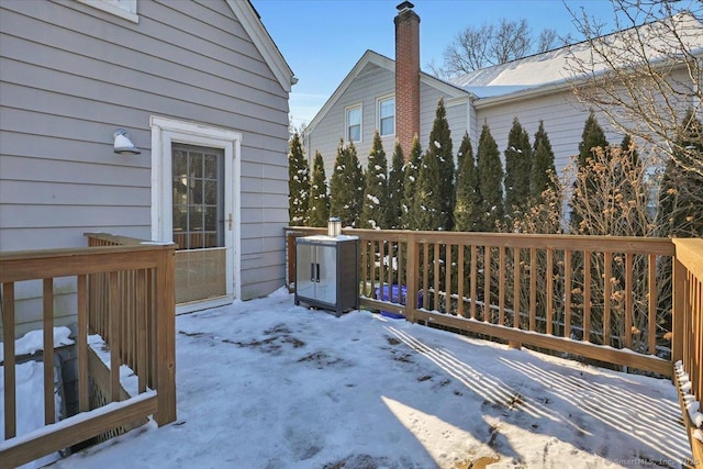 view of snow covered deck