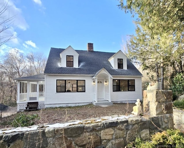 cape cod-style house featuring a sunroom