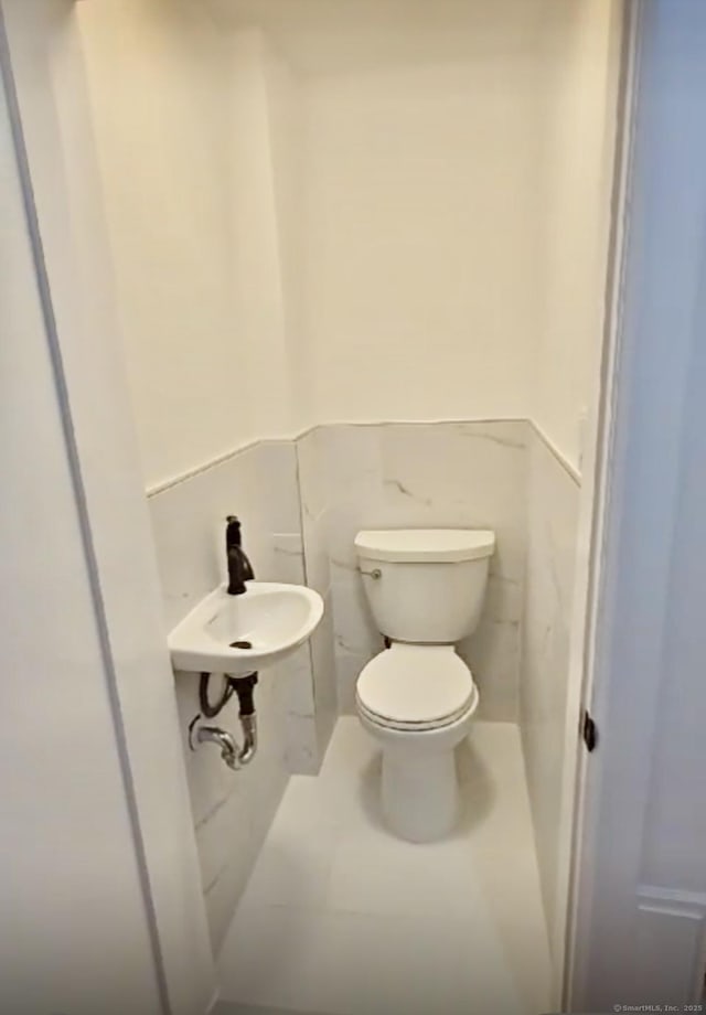 bathroom with sink and toilet