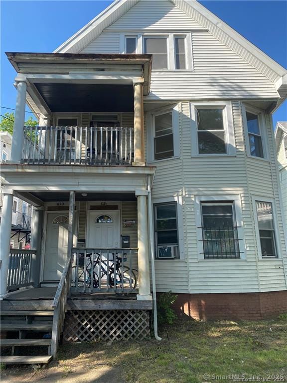 view of front of property with cooling unit and covered porch