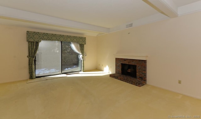 unfurnished living room featuring carpet floors, a fireplace, and beam ceiling