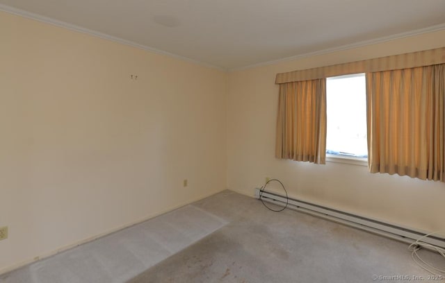 spare room with crown molding, a baseboard radiator, and light colored carpet