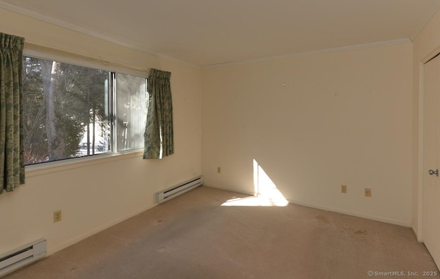 carpeted empty room with crown molding and a baseboard heating unit