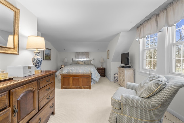 carpeted bedroom featuring vaulted ceiling