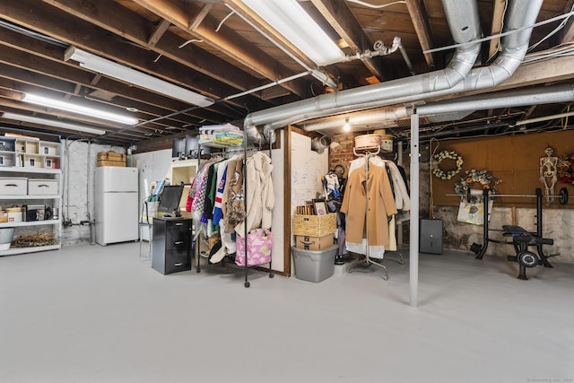 basement with white refrigerator