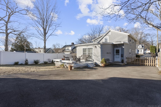 back of house featuring a deck