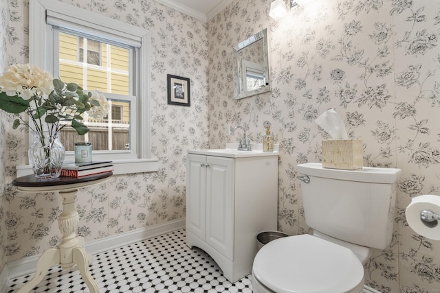 bathroom featuring vanity, tile patterned flooring, crown molding, and toilet