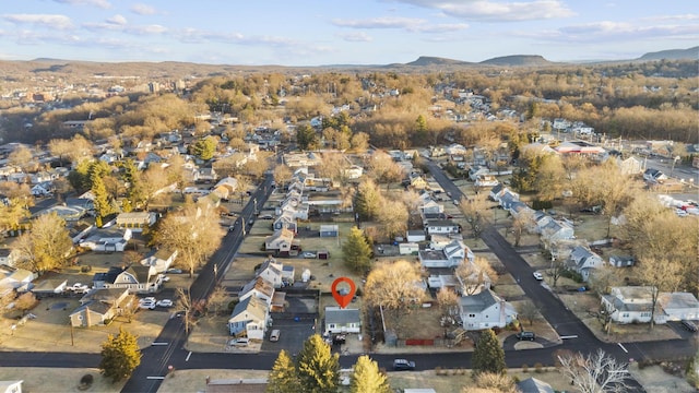 birds eye view of property featuring a mountain view