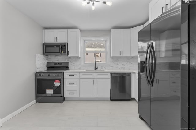 kitchen featuring white cabinetry, sink, backsplash, and black appliances