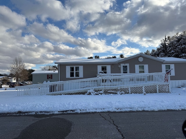 manufactured / mobile home with a wooden deck