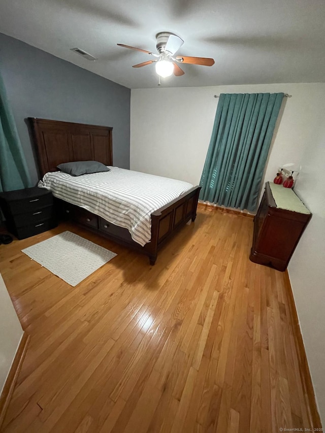 bedroom featuring ceiling fan and light hardwood / wood-style floors