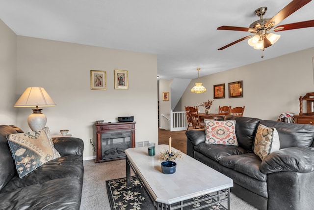 living room featuring carpet floors and ceiling fan