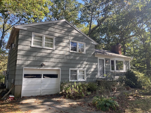 view of property exterior with a garage