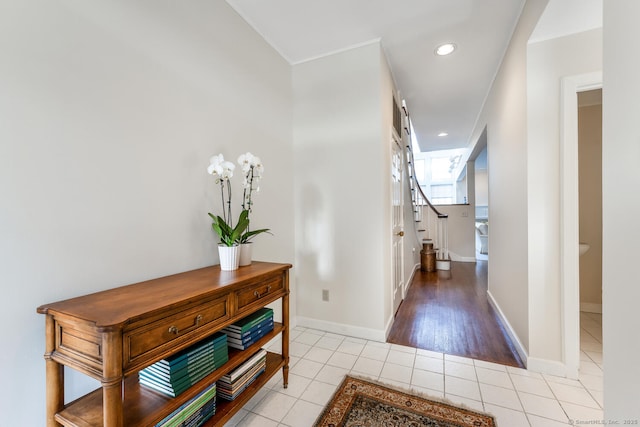 corridor featuring light tile patterned floors