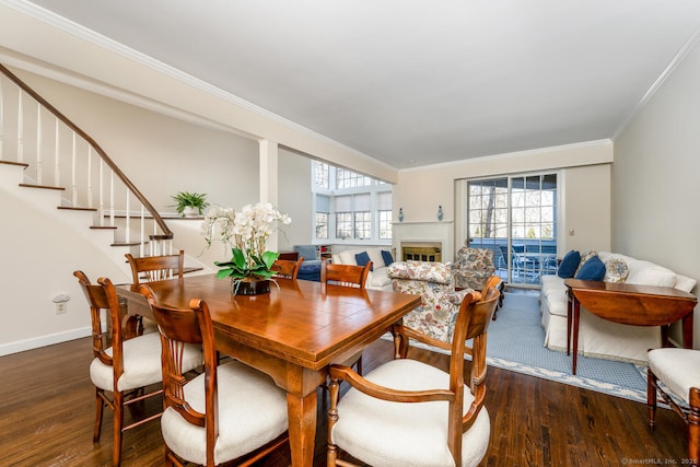 dining room with crown molding and dark hardwood / wood-style floors