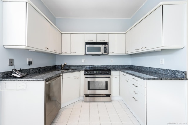 kitchen with sink, stainless steel appliances, and white cabinets