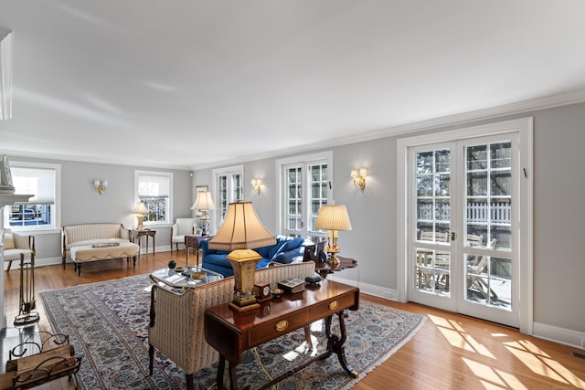 living area featuring light wood-type flooring and baseboards