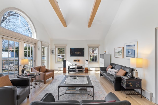 living room featuring high vaulted ceiling, beamed ceiling, and wood finished floors