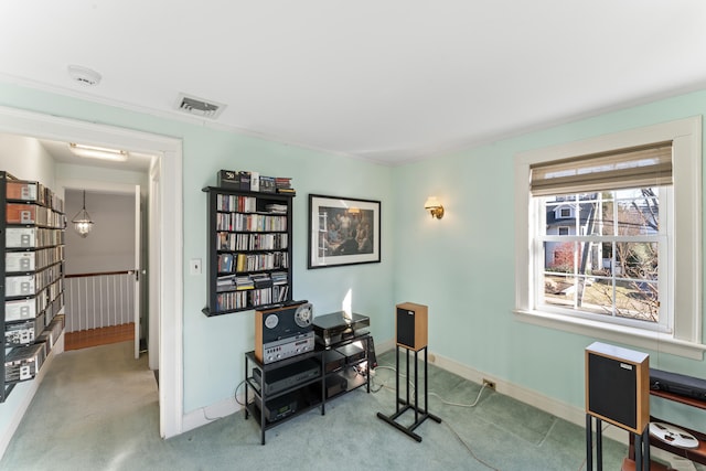 carpeted office with visible vents and baseboards