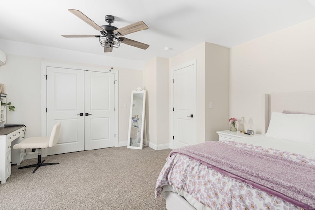 carpeted bedroom featuring ceiling fan and a closet