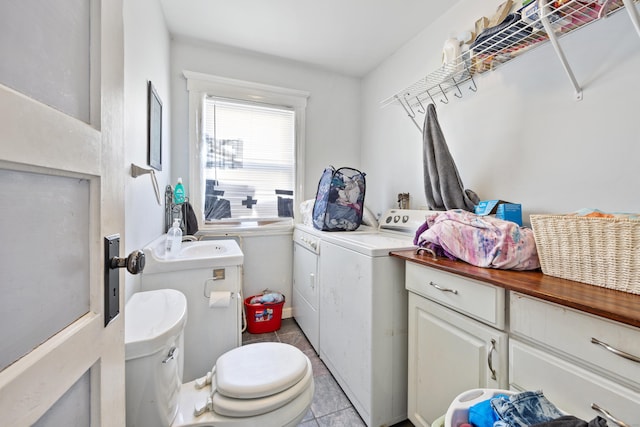 laundry room featuring light tile patterned flooring and independent washer and dryer