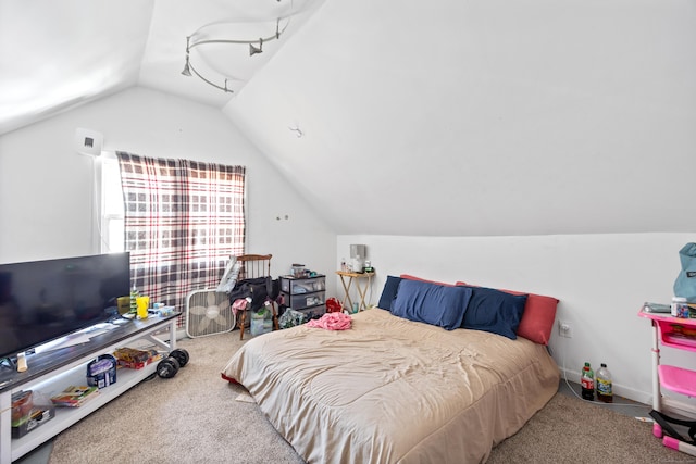 carpeted bedroom featuring lofted ceiling