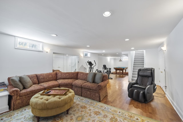 living room with pool table and light hardwood / wood-style flooring