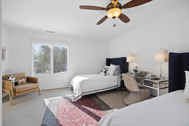 bedroom featuring light carpet and ceiling fan