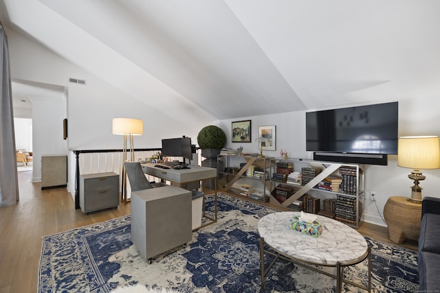 office featuring hardwood / wood-style flooring and lofted ceiling