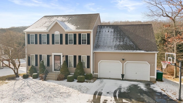 colonial-style house featuring a garage