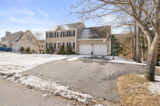 colonial-style house featuring a garage