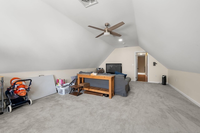 interior space featuring vaulted ceiling, light colored carpet, and ceiling fan