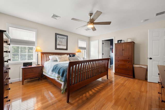 bedroom with ceiling fan and light hardwood / wood-style flooring