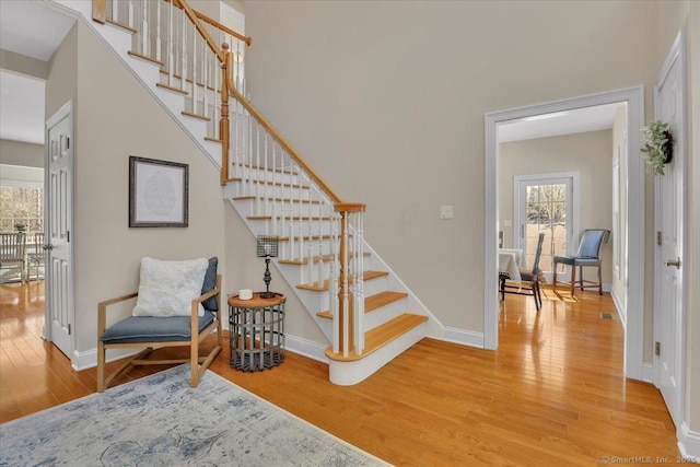 stairs with wood-type flooring