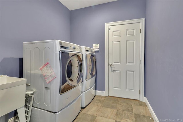 laundry area with washer and dryer and sink