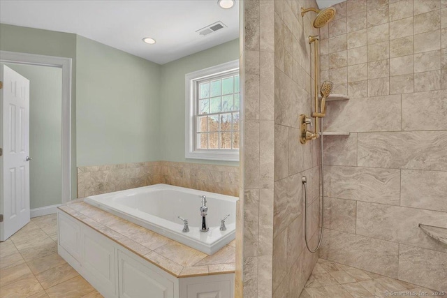 bathroom with separate shower and tub and tile patterned flooring