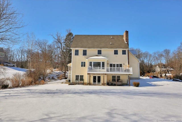 view of snow covered house